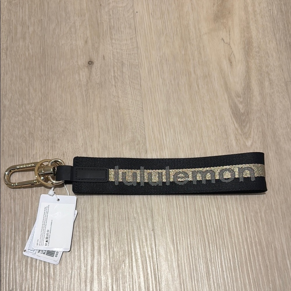 Lululemon Black and Gold Keychain